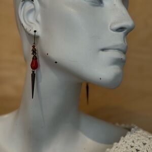 Red dangle earrings with spikes